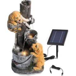 Solarbrunnen Hundewelpen Milo und Buddy an beleuchteter Wasserquelle