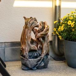 Solar Zierbrunnen im dekorativen Wurzeldesign und LED Licht